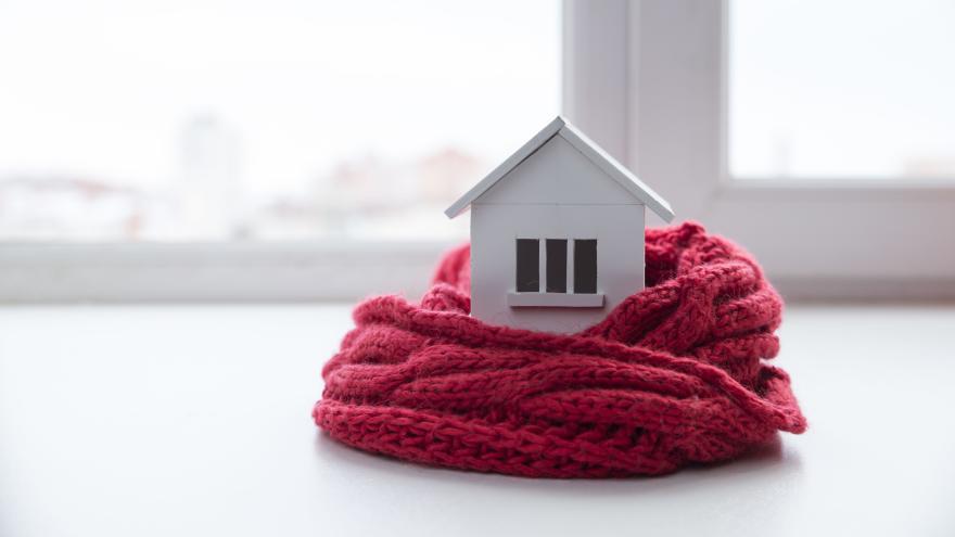 Fernwärme: Haus mit Schal eingepackt