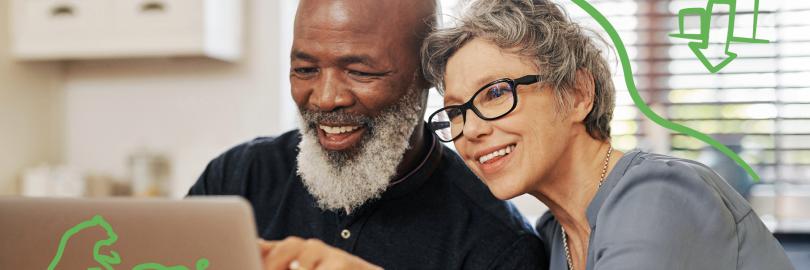 Schmuckbild: Mann und Frau schauen auf Laptop, die Frau zeigt auf etwas auf dem Bildschirm